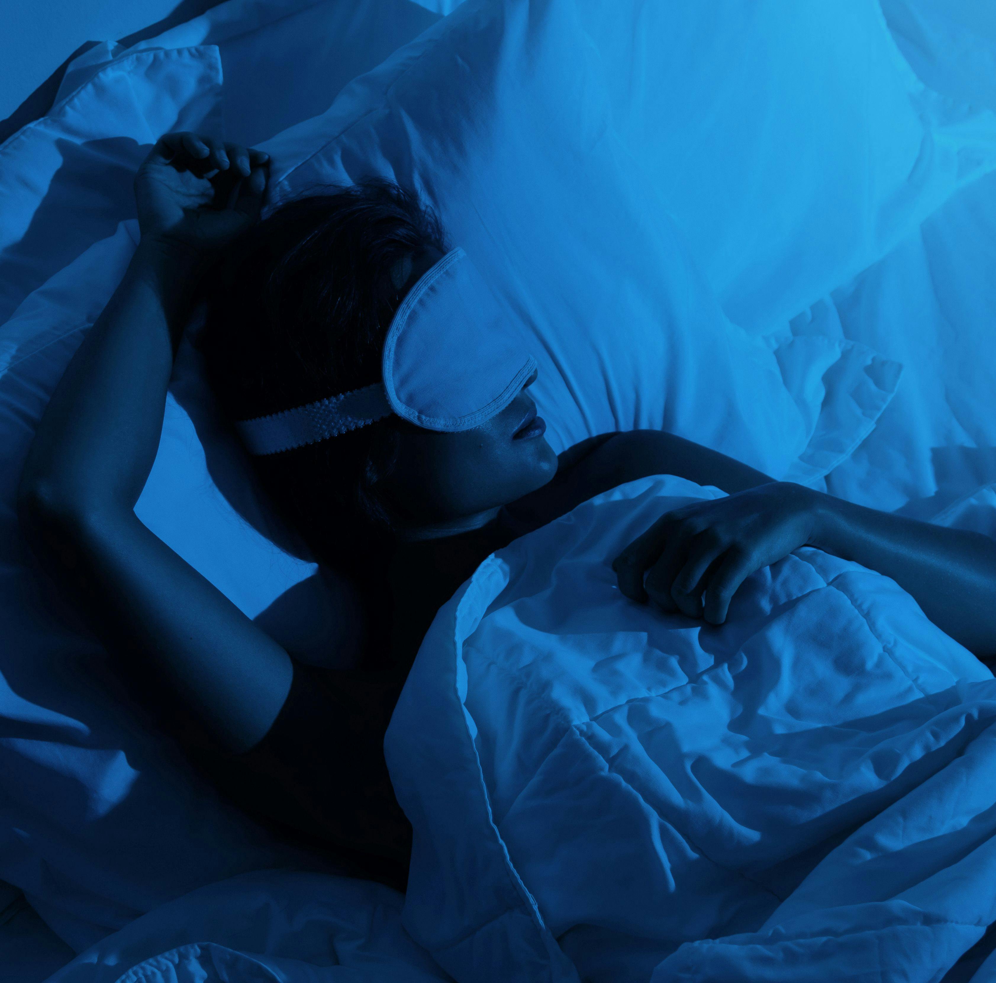 person sleeping in bed | Credit: Adobe Stock