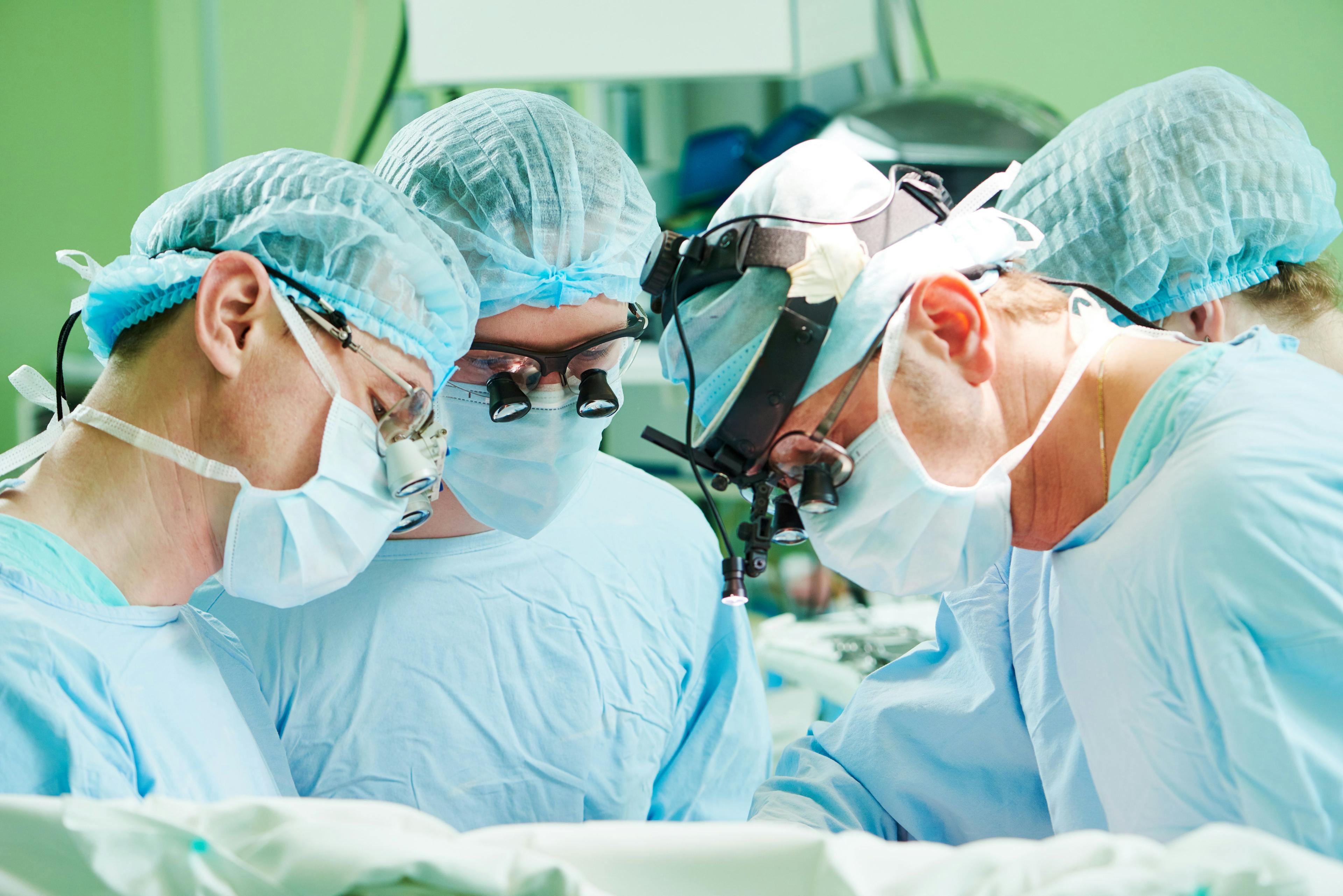 Surgeons performing an amputation.