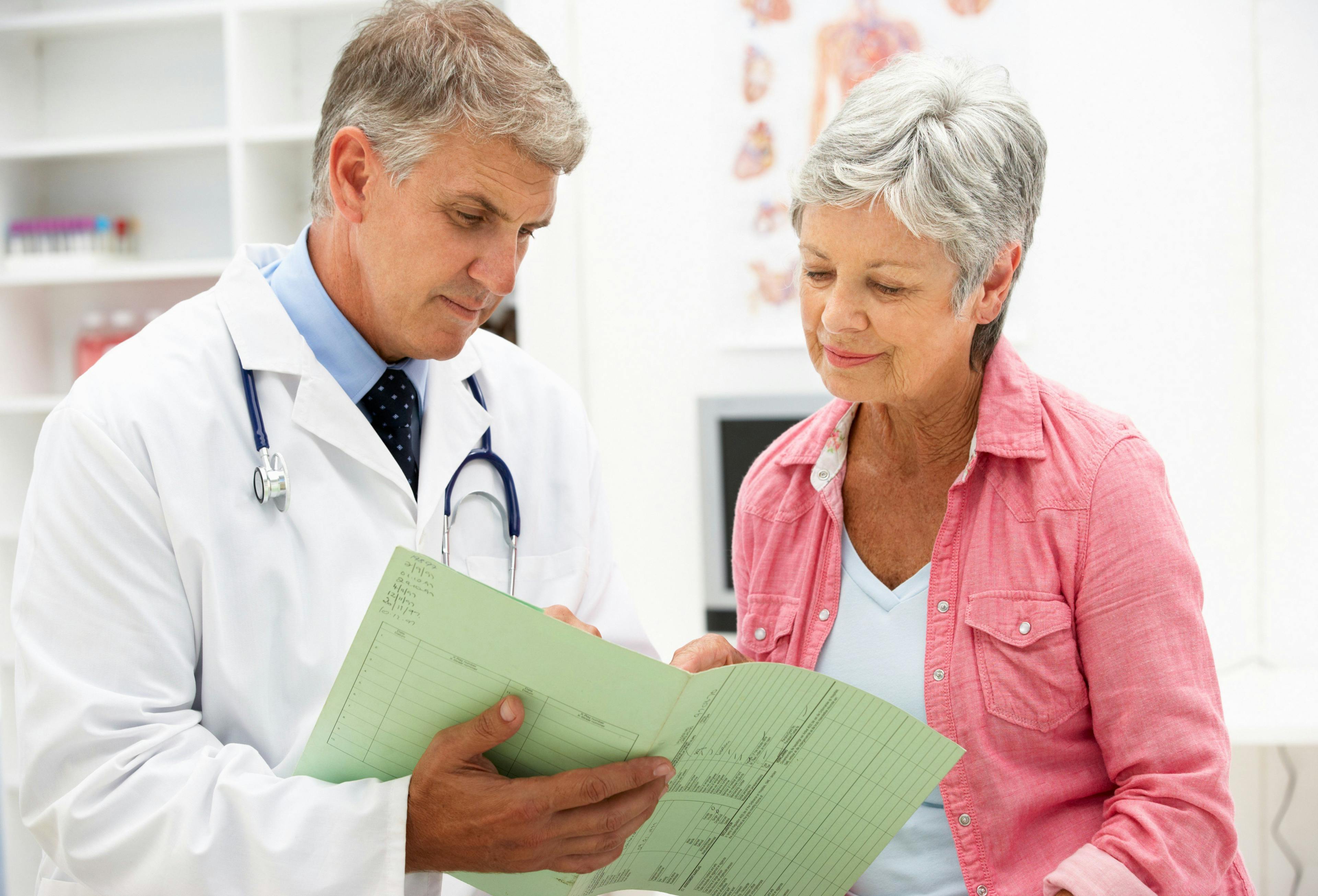 Doctor discussing hormone therapy with an older woman.