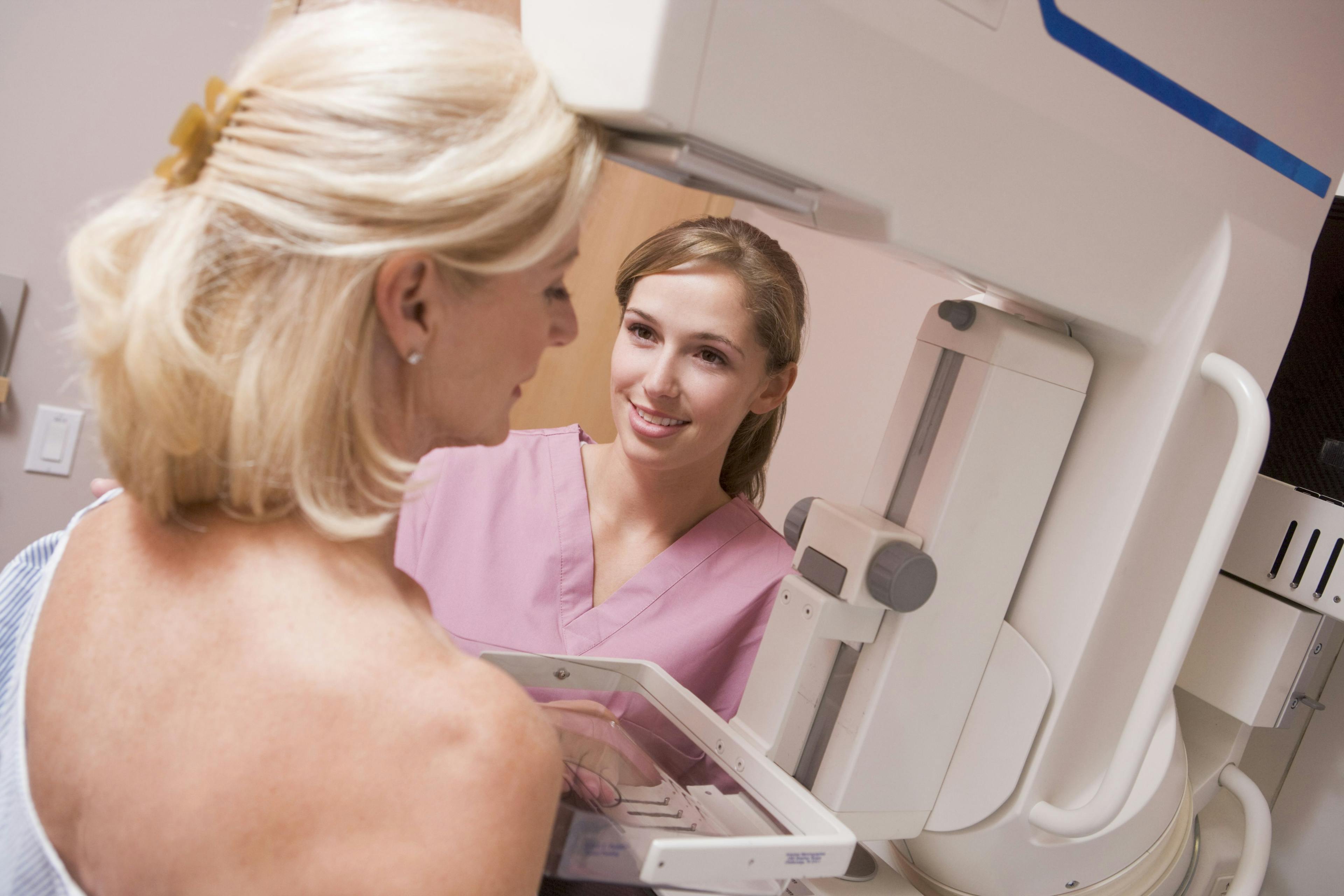 A woman undergoing a mammogram