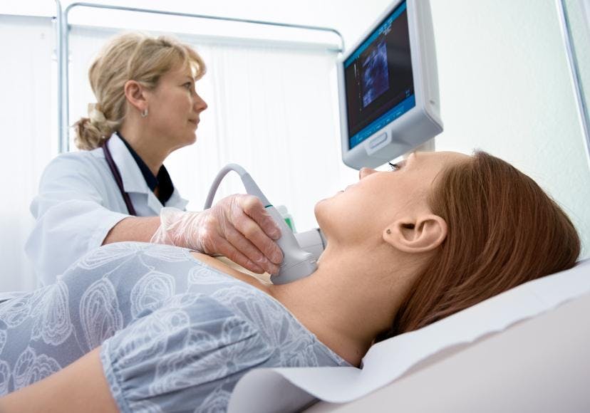 A patient undergoing a thyroid ultrasound.
