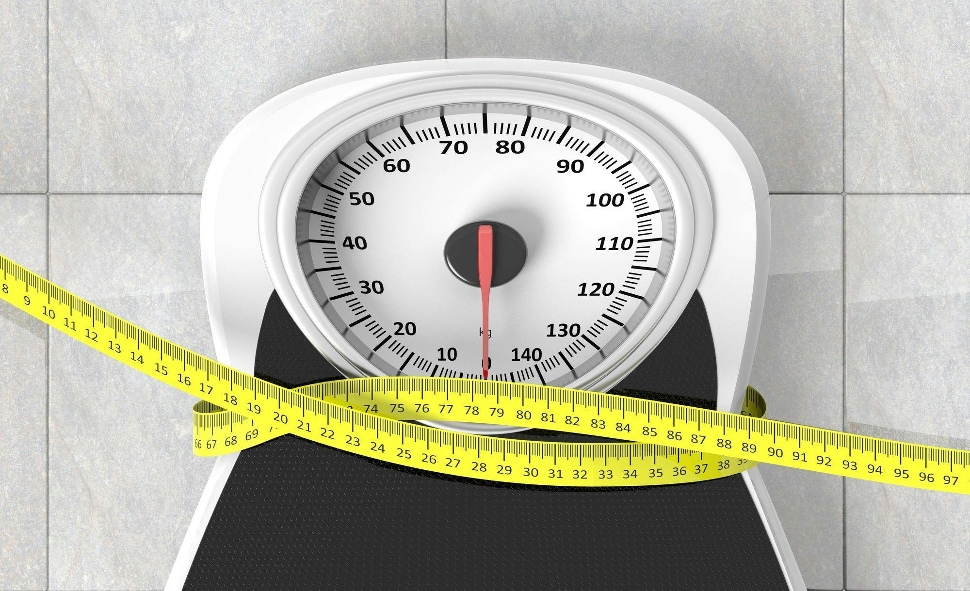 Weight management-related stock imagery depicting a measuring tape wrapped around a scale. 