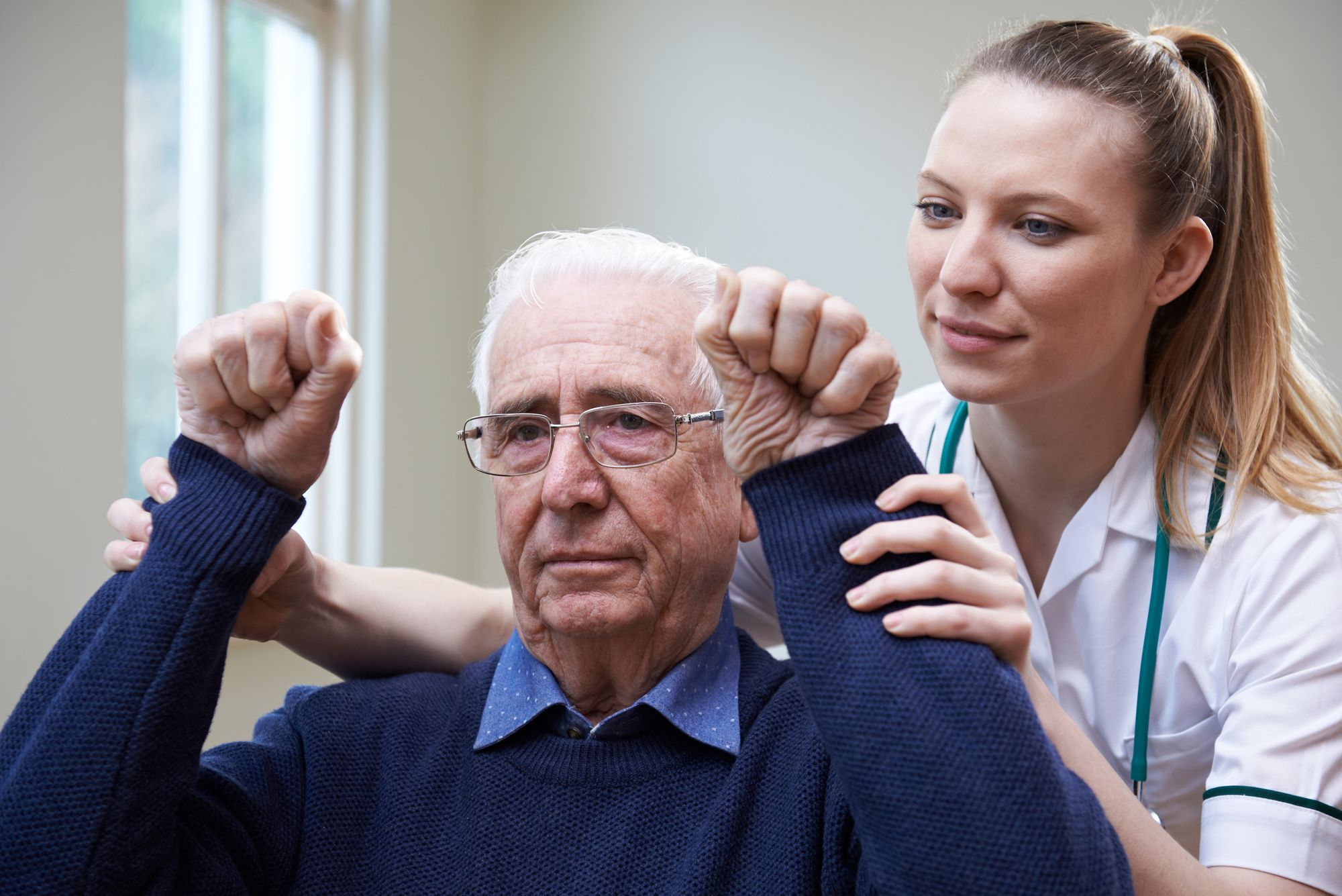 Older patient in stroke rehab with a clinician