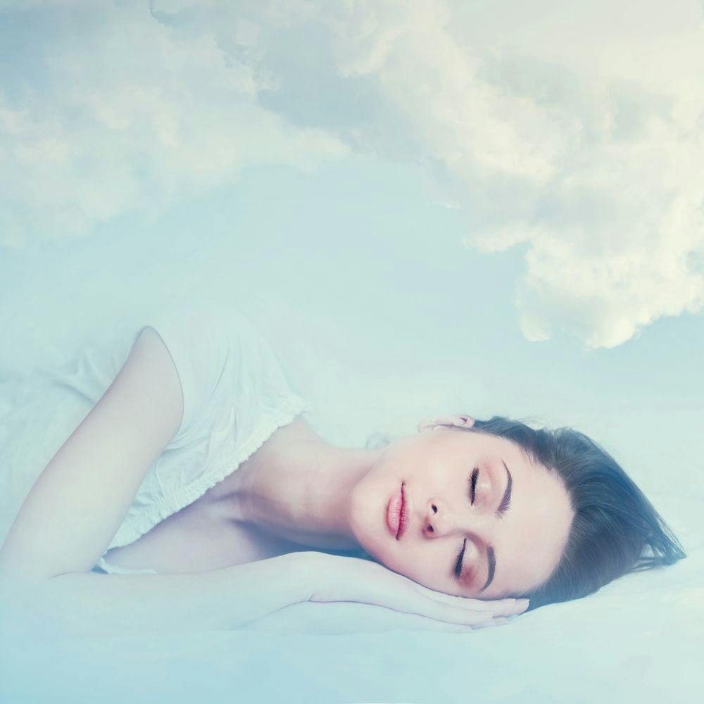 Woman sleeping clouds insomnia fibromyalgia