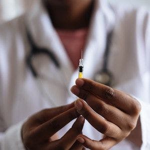 Close-up of needle in doctor's hands │ Pexels