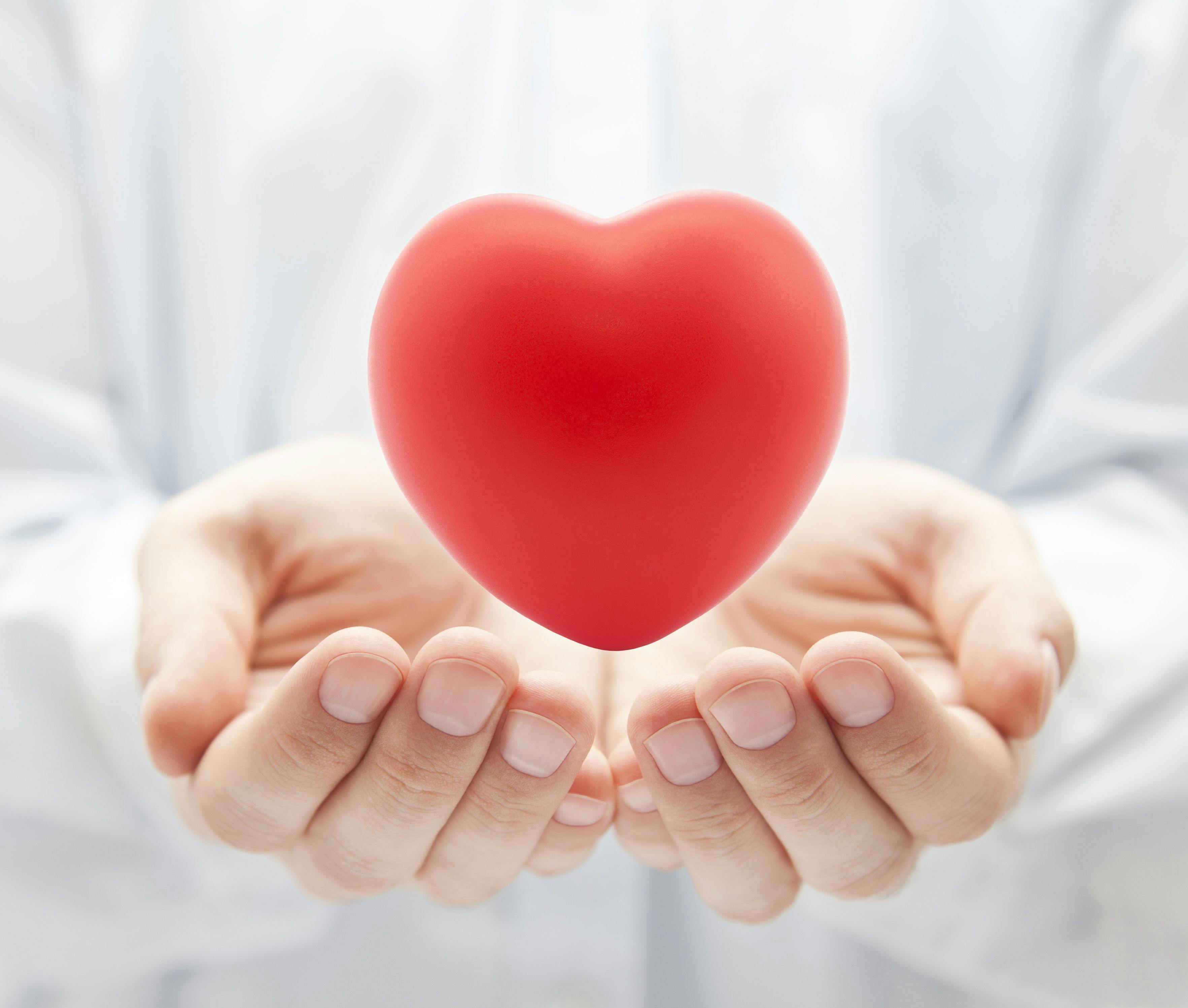 Stock image of a doctors holding a heart.