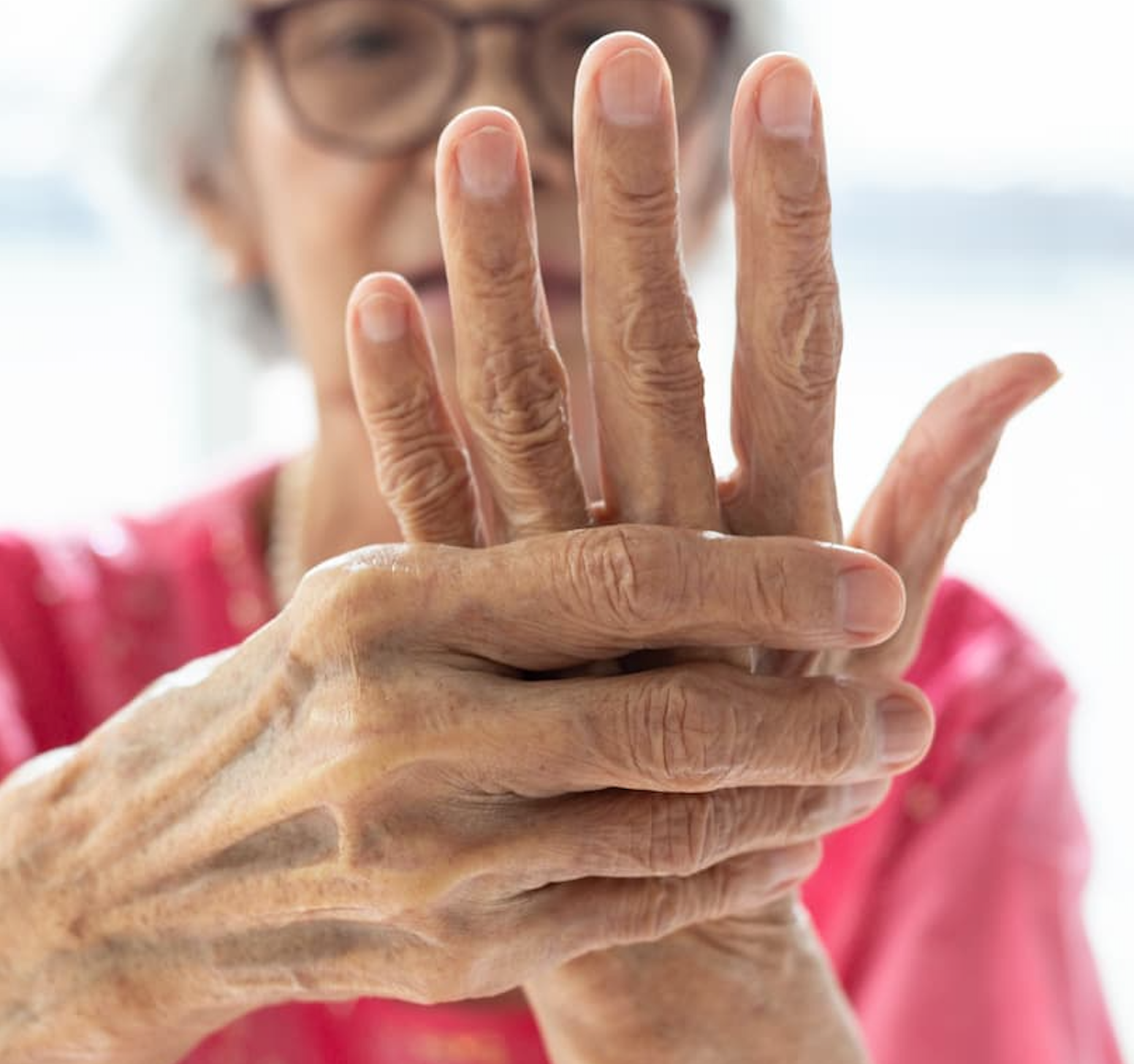 Woman holding hand in pain | Image Credit: Adobe Stock/Satjawat