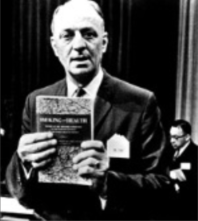 Luther Terry, MD, displays the 1964 Surgeon General Report | Credit: US Centers for Disease Control and Prevention