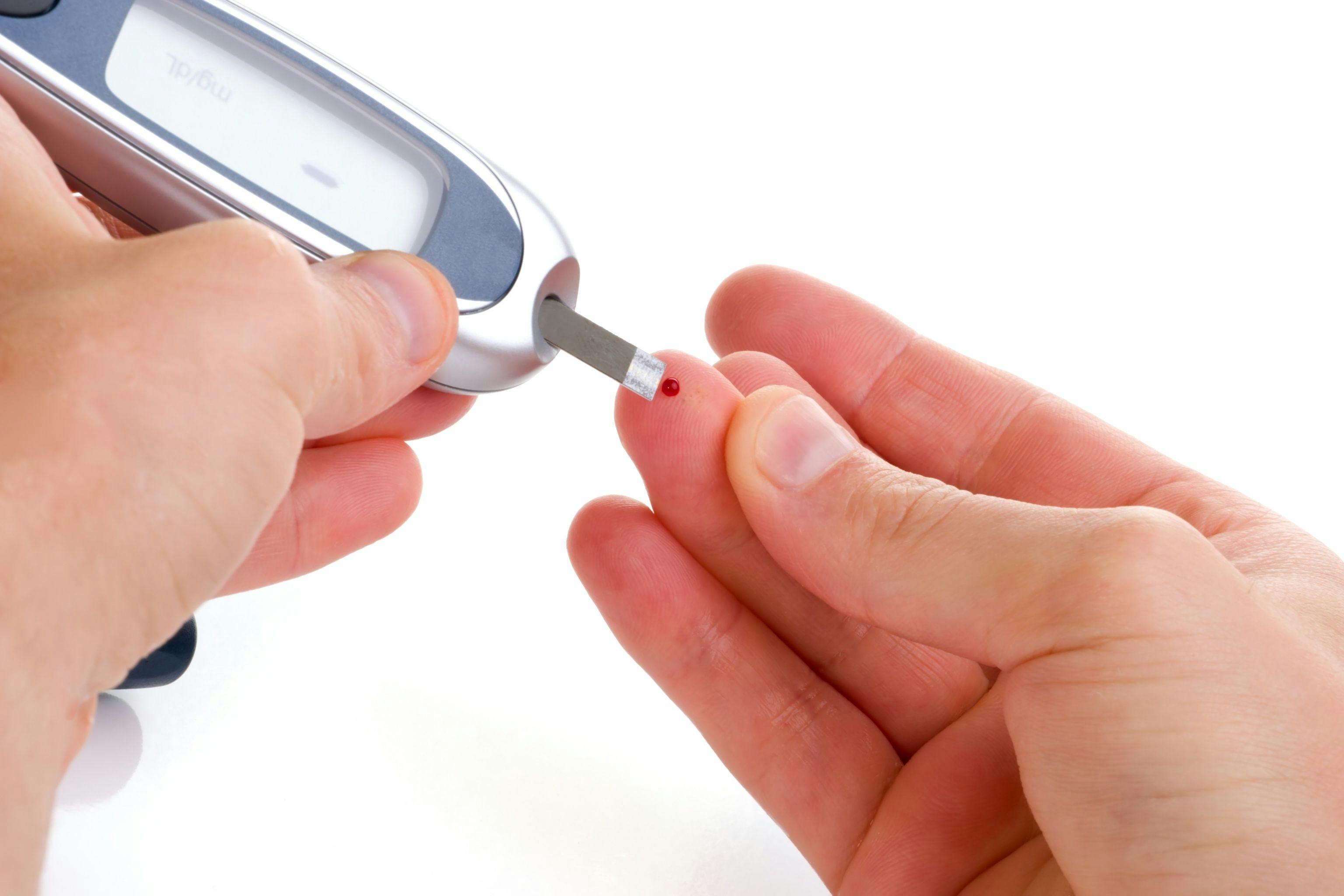 Person with diabetes checking their blood glucose levels.