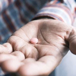 Close-up of hand with pill │ Credit: Unsplash/Towfiqu barbhuiya